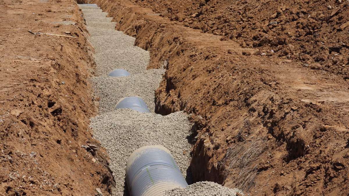 Drainage system directing water away from a residential crawlspace