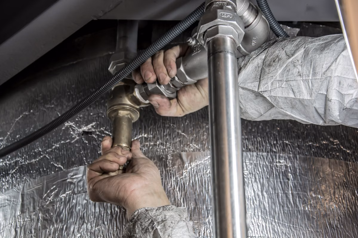 Professional crawlspace dehumidifier installation in a clean encapsulated crawlspace